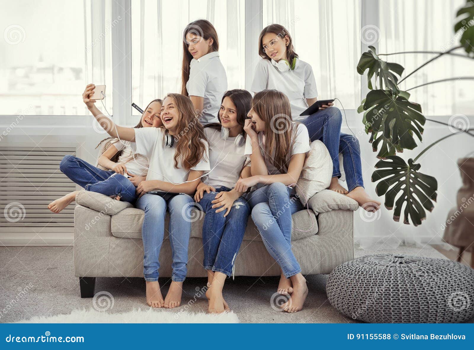 Selfie with friends. Friendly smiling teenagers making group photo