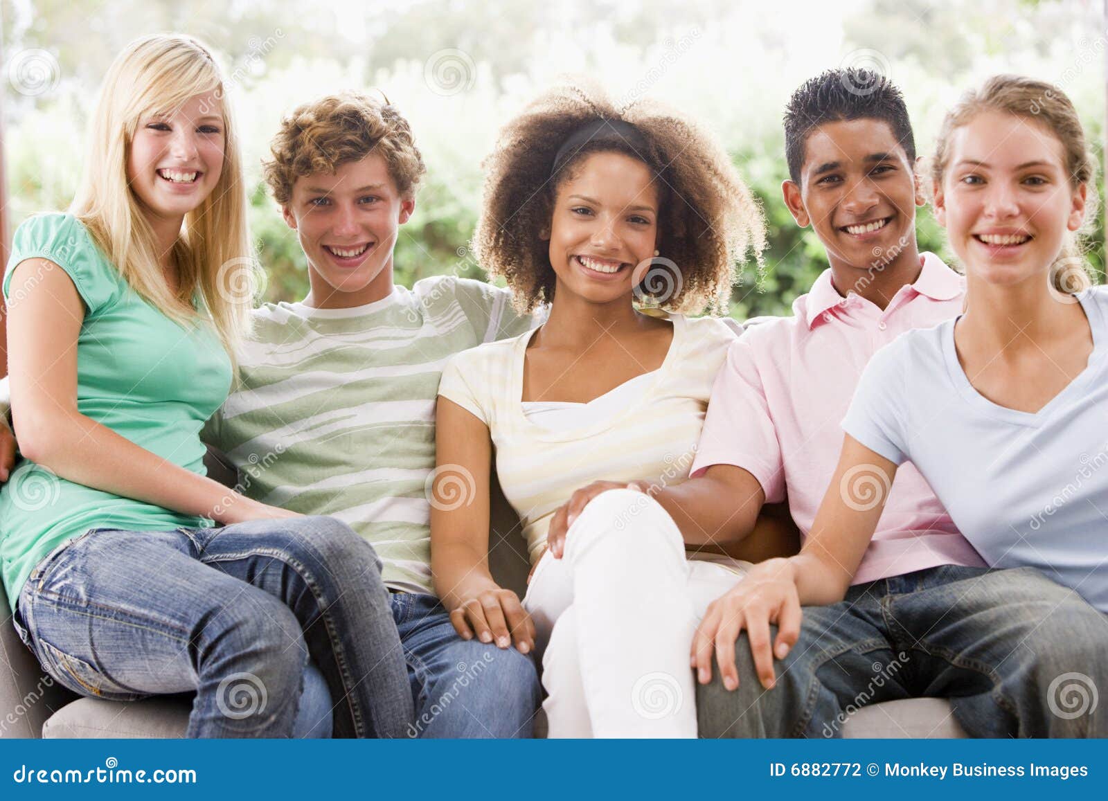 Group of Teenagers Sitting on a Couch Stock Photo - Image of home ...