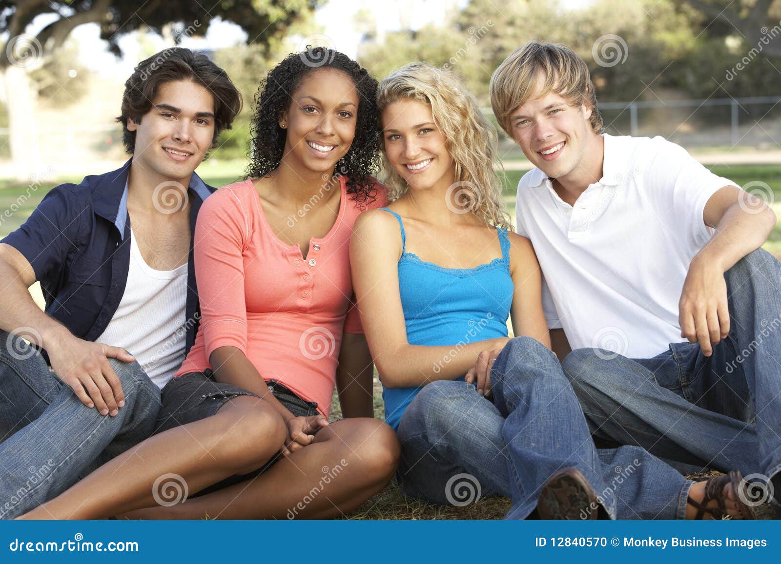 Group of Teenagers Sitting in Playground Stock Photo - Image of group ...