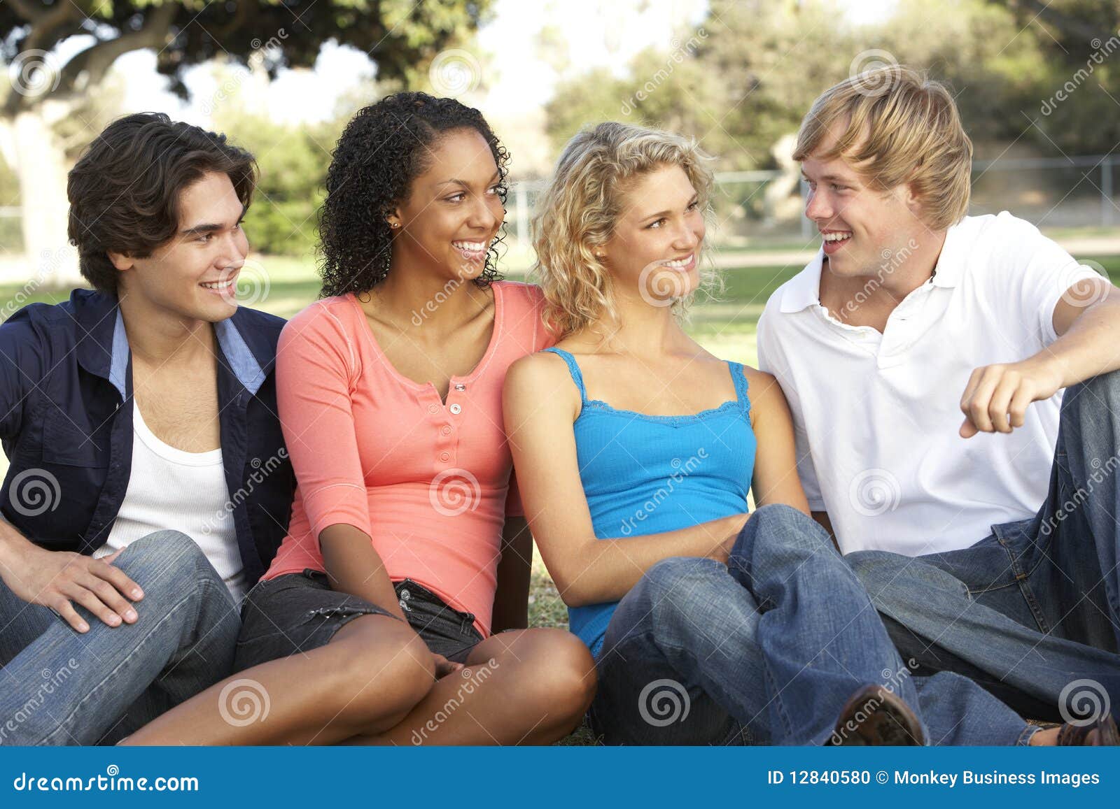 Group of Teenagers Sitting in Playground Stock Photo - Image of mates ...