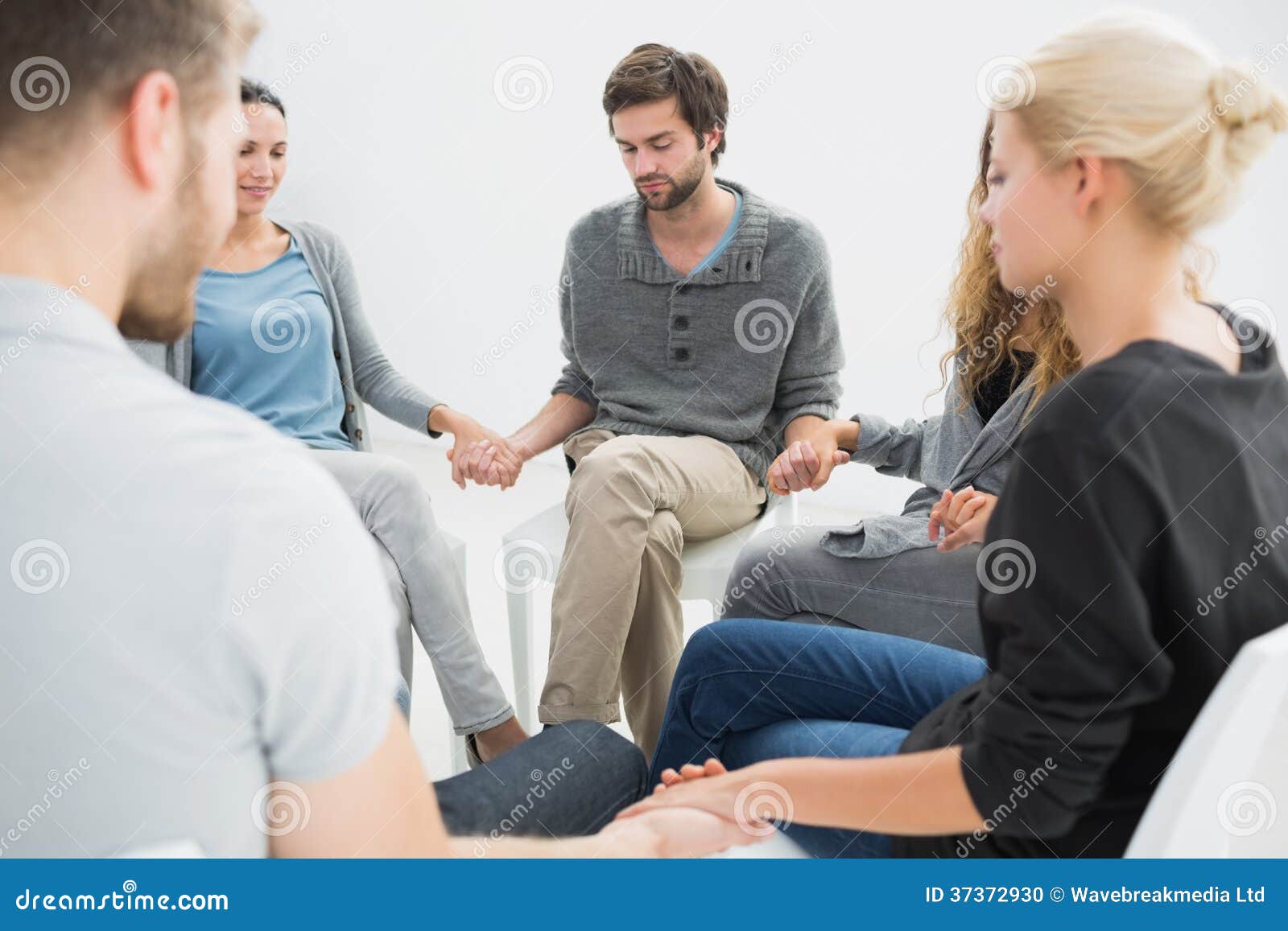 Group Therapy in Session Sitting in a Circle Stock Photo Image of