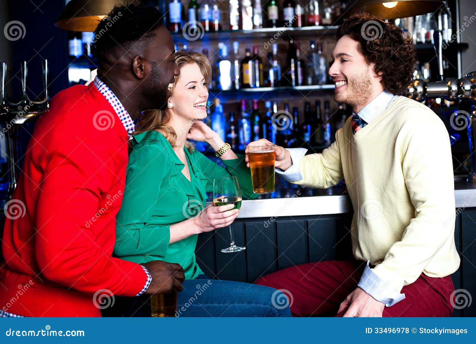 Download Group Of Three Friends In A Bar Drinking Beer Stock Photo ...
