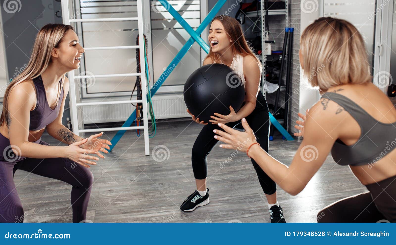 Group Of Three Young Sporty Smile Girls Workout With ...