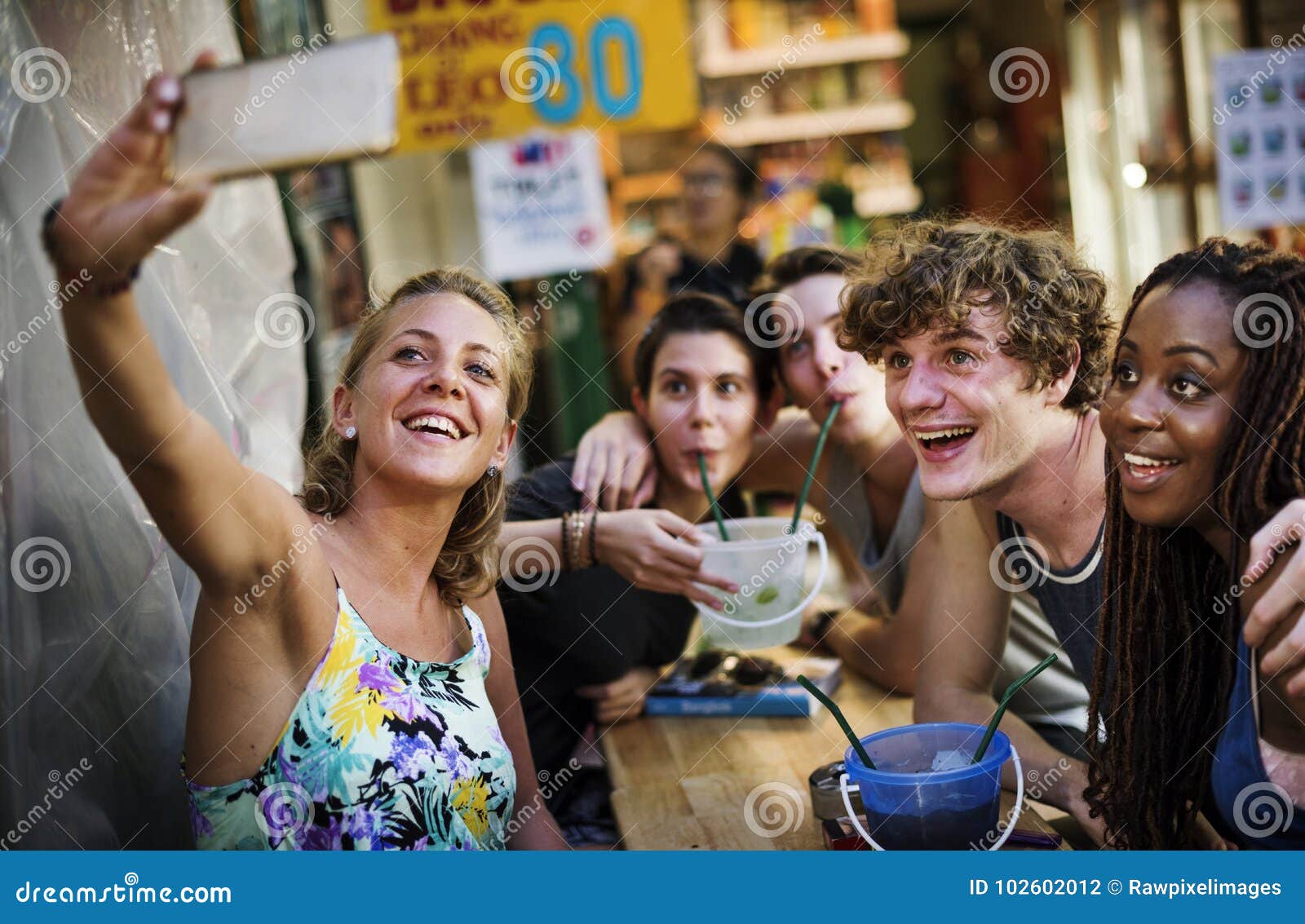 a group of tourists enjoying bucket drinks in khao san roa, bang