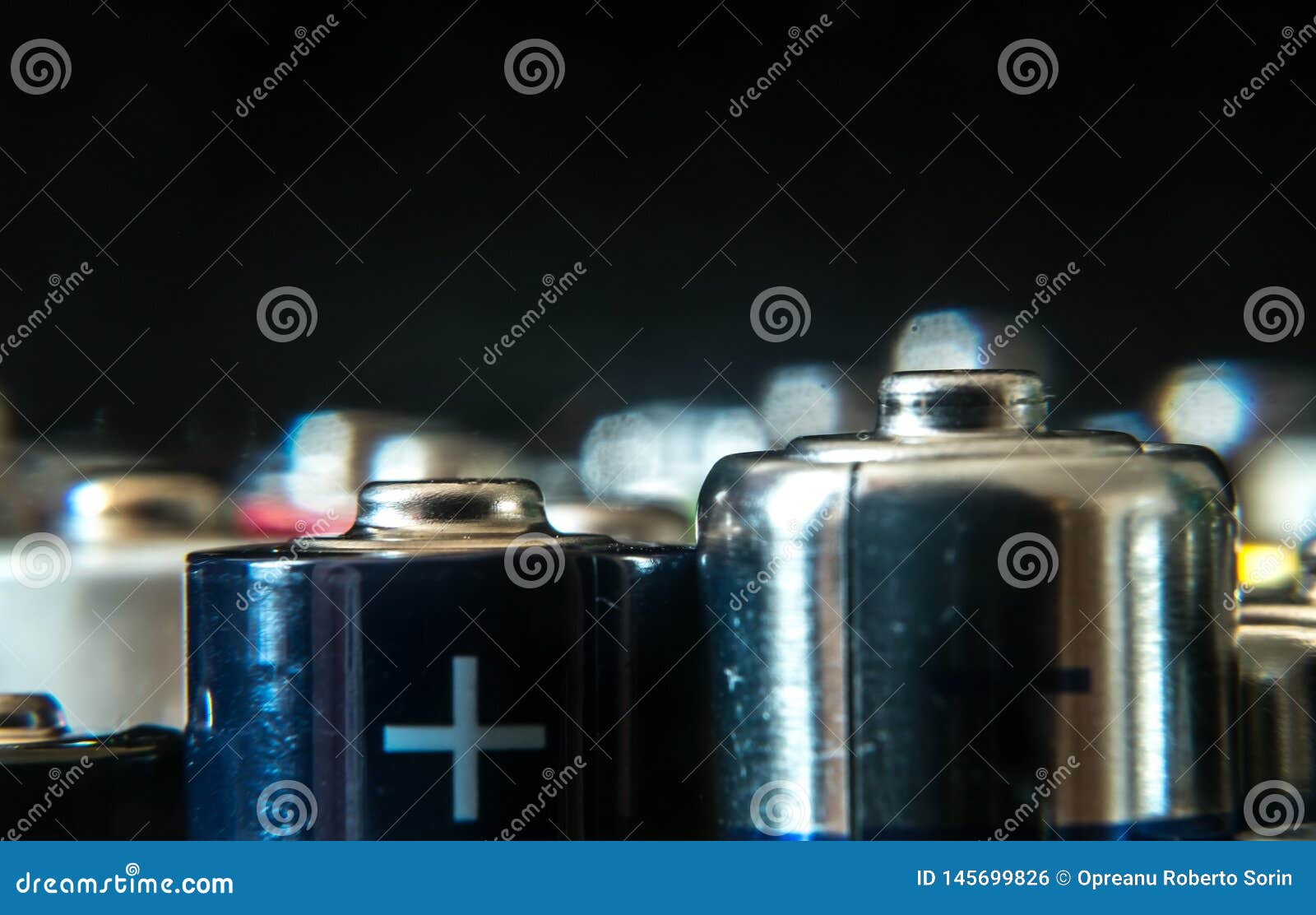 Group of Used Disposable Drain Batteries of Various Size Stock Photo