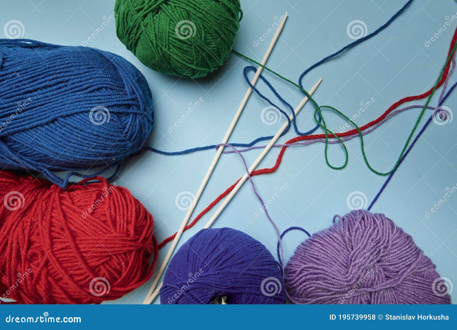 Group of Various Yarn Balls and Knitting Needles Closeup Stock Photo