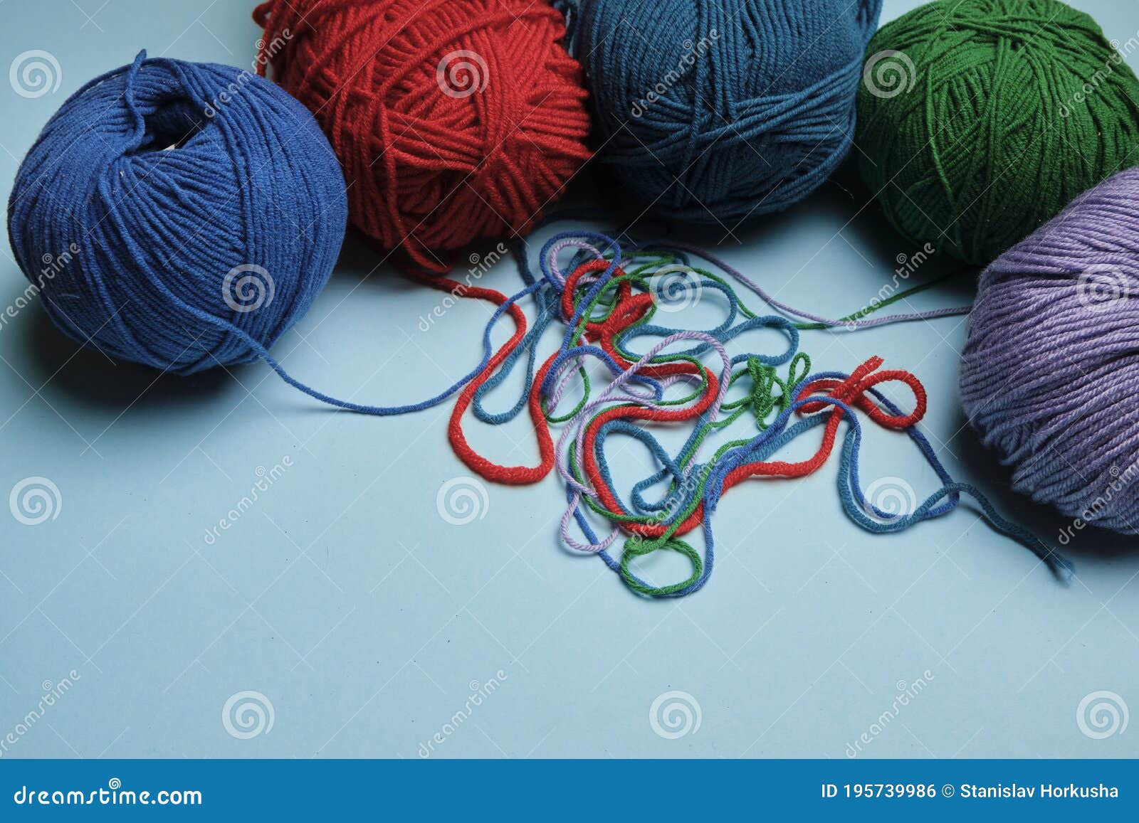Group of Various Yarn Balls and Knitting Needles Closeup Stock Photo