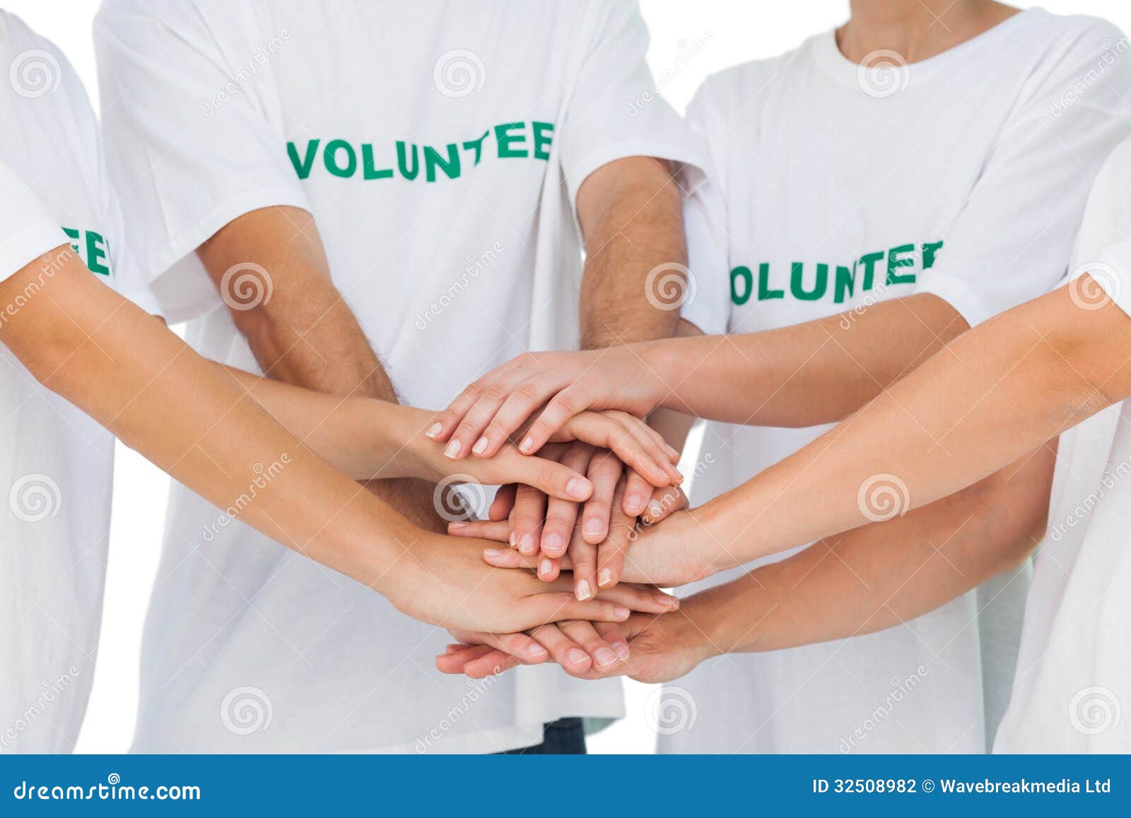 group of volunteers putting hands together