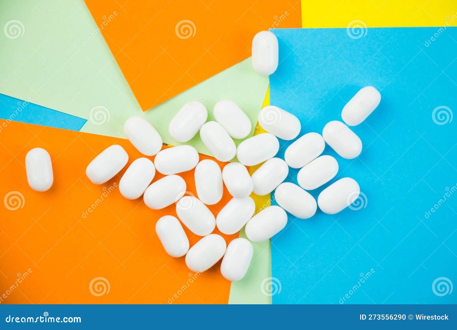 Group of White Hard Candies Arranged Neatly on a Vibrantcolored