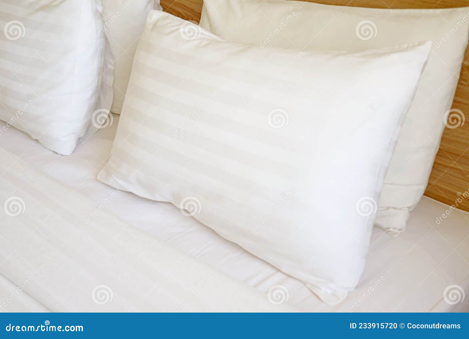 Group of White Pillows on the Bed for the Concept of QUALITY SLEEP