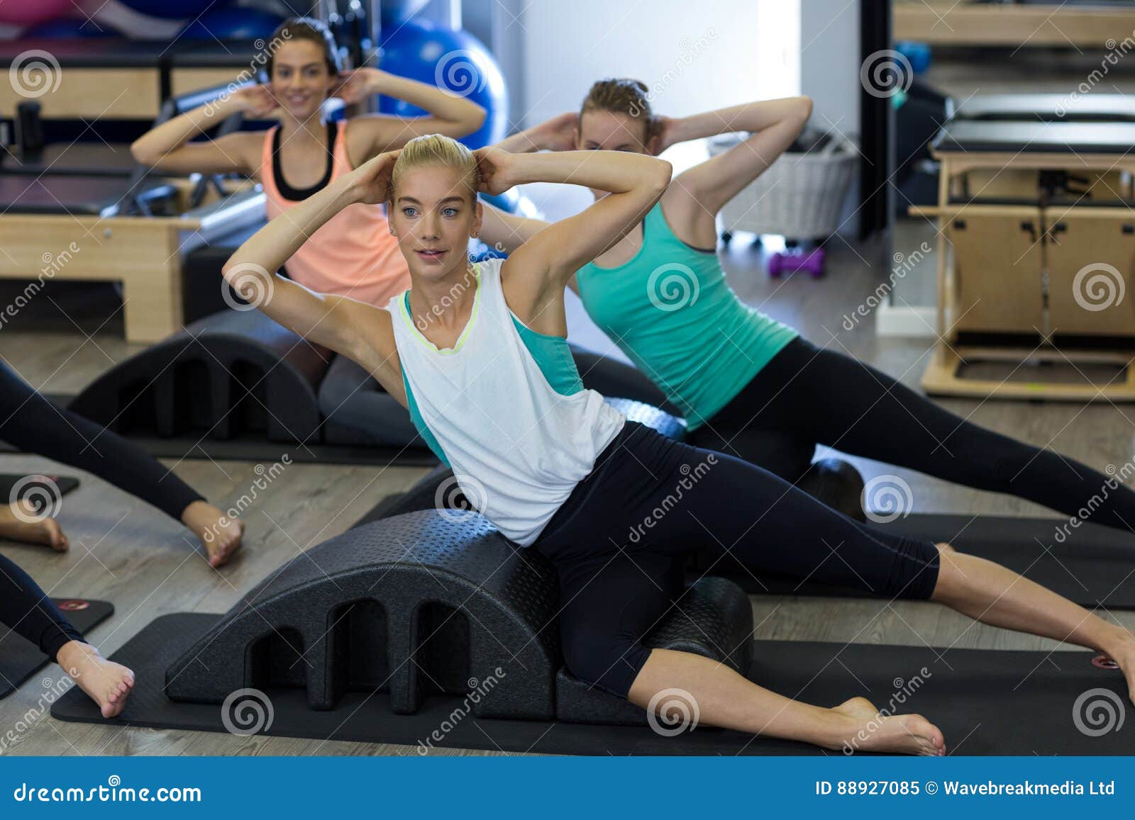 Group of Women Exercising on Arc Barrel Stock Image - Image of
