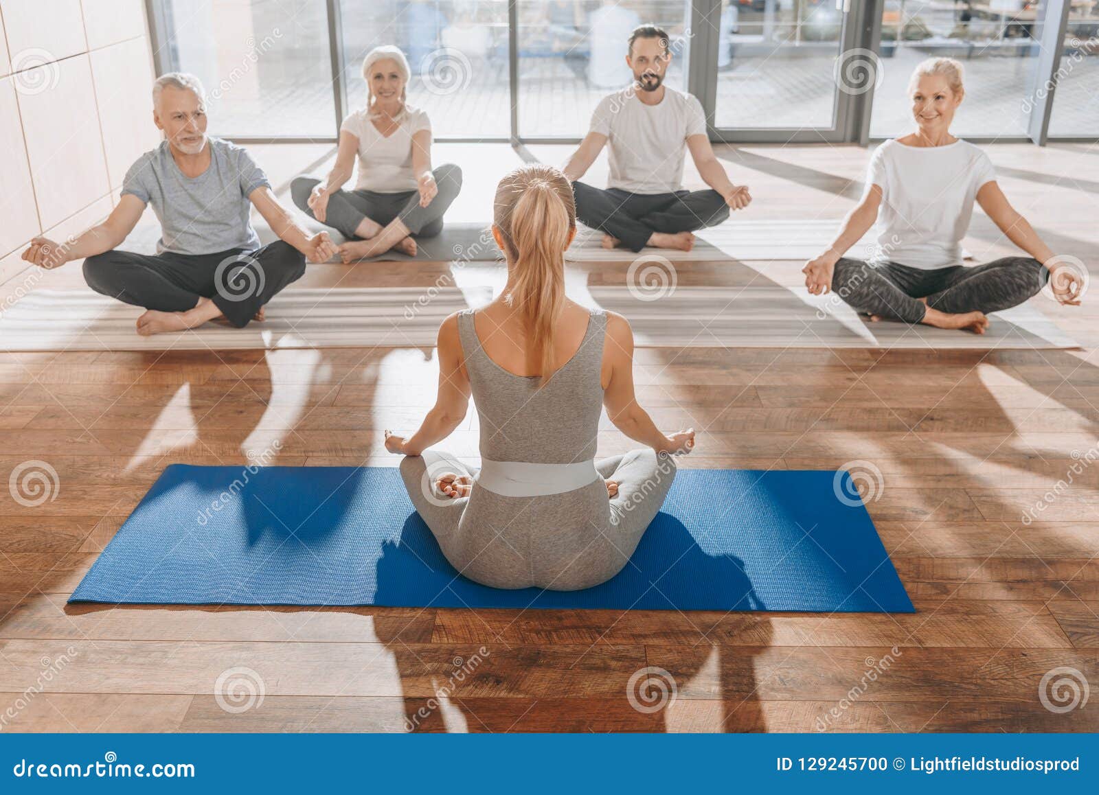 Group Of Women Meditating In Lotus Yoga Pose With Mudra Stock Photo Image Of Harmony Fitnessstudio