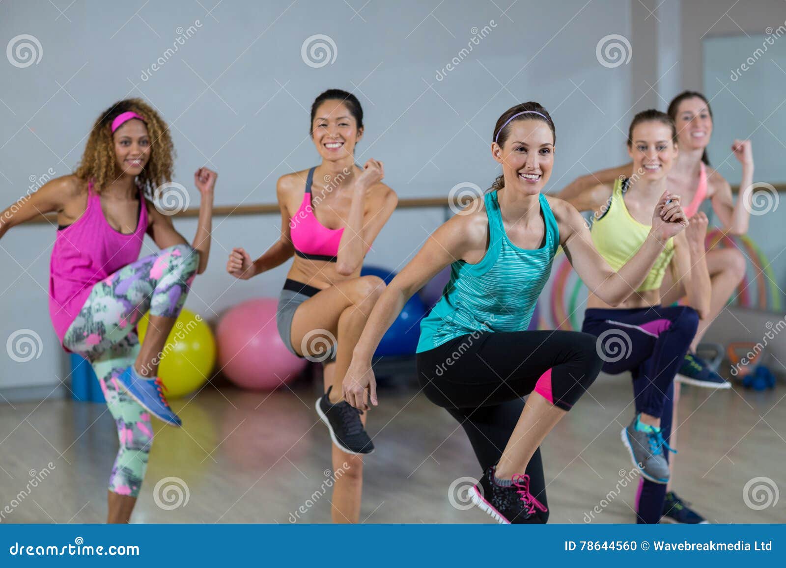 group of women performing aerobics