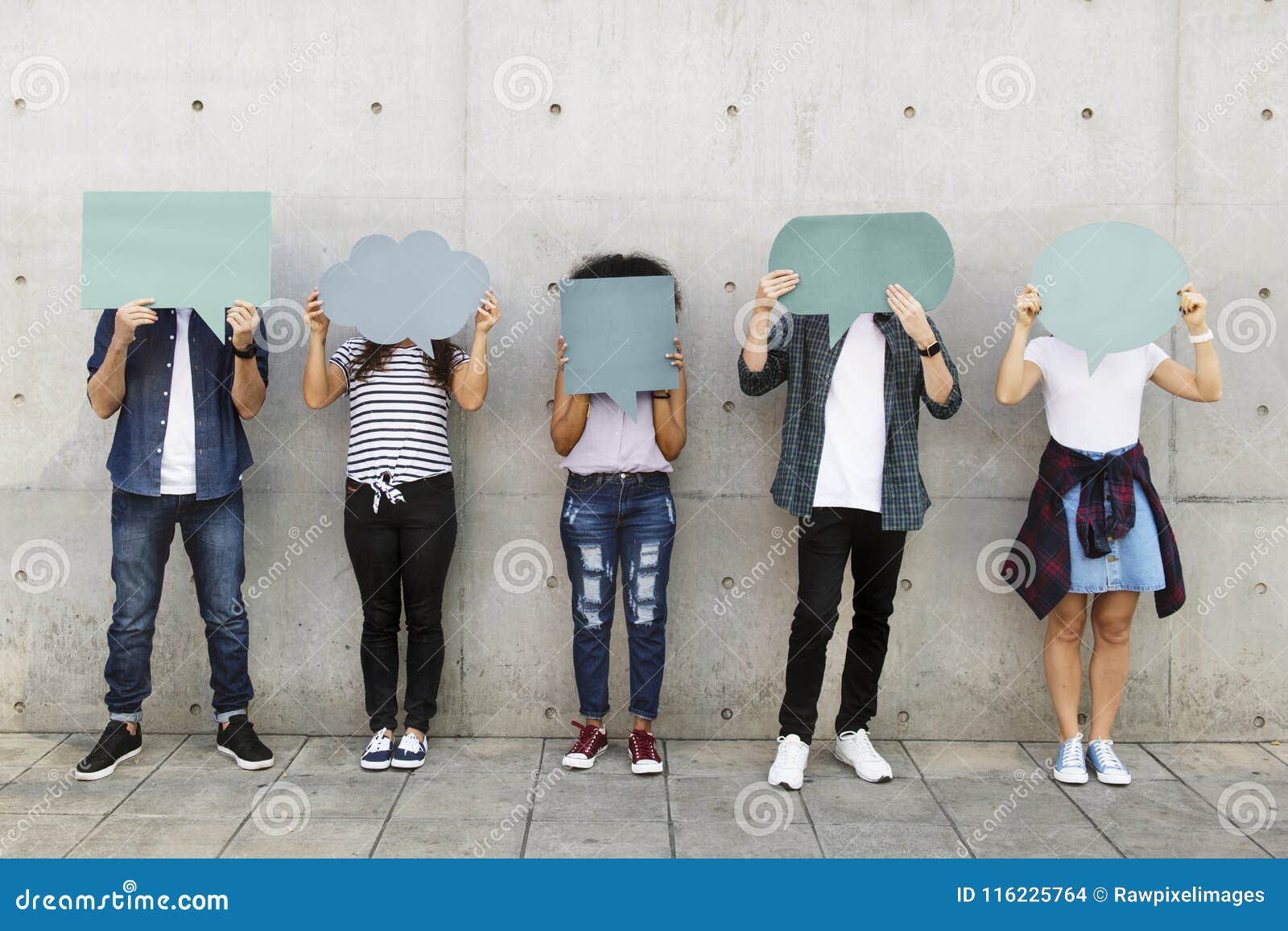 group of young adults outdoors holding empty placard copyspace t