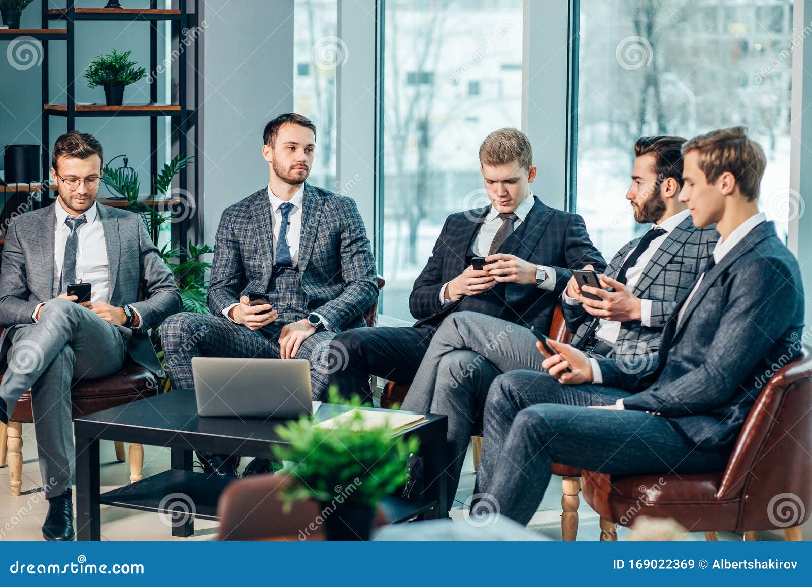 Group of Business Men Have Active Discussion in Modern Office Stock