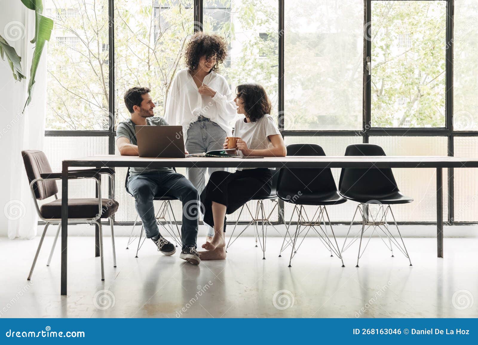 Group of Young Colleagues Interacting in Spacious Bright Loft Coworking Space. Creative Ideas