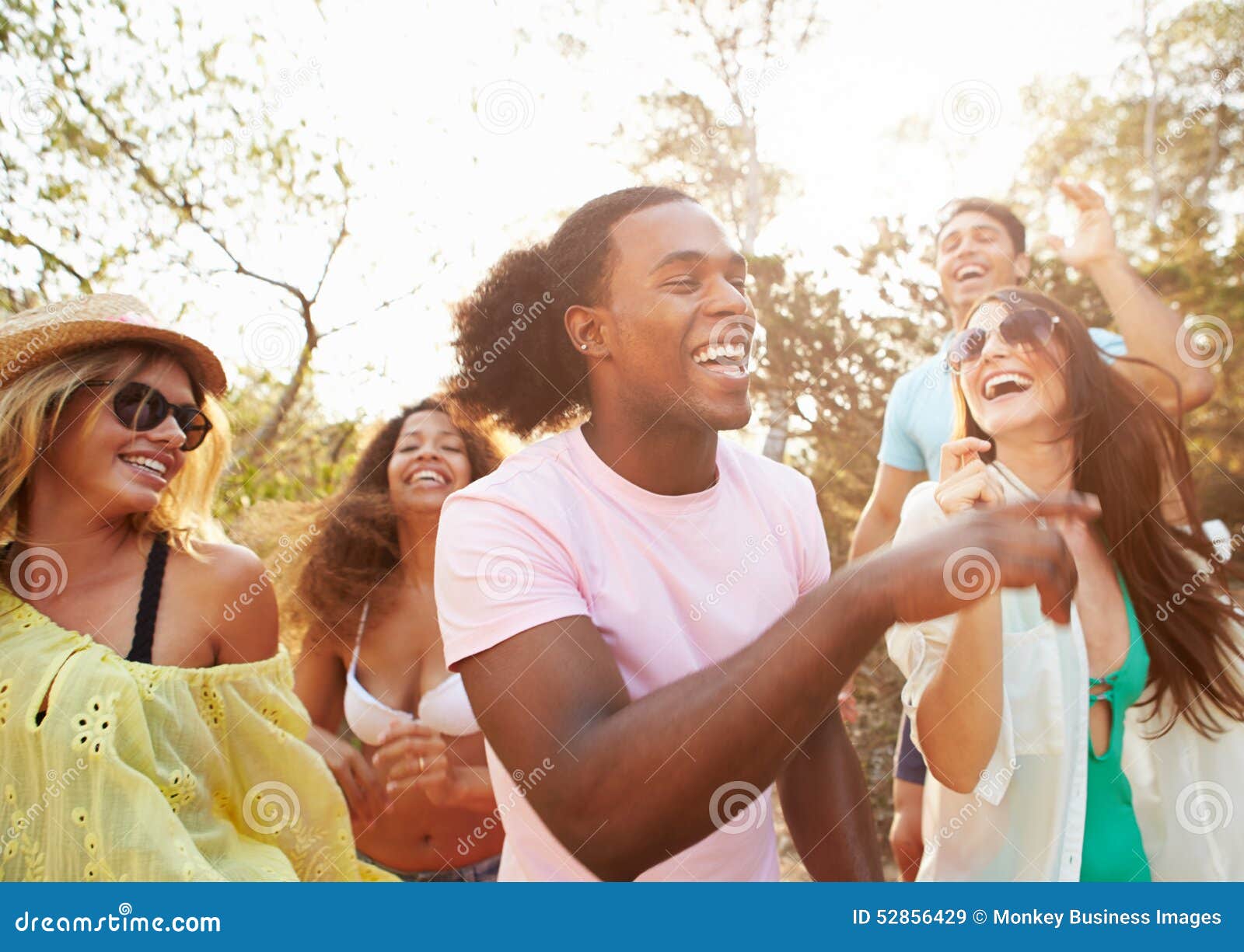 Large Group Of Young People Enjoying A Beach Party Stock Photo, Picture and  Royalty Free Image. Image 21131228.