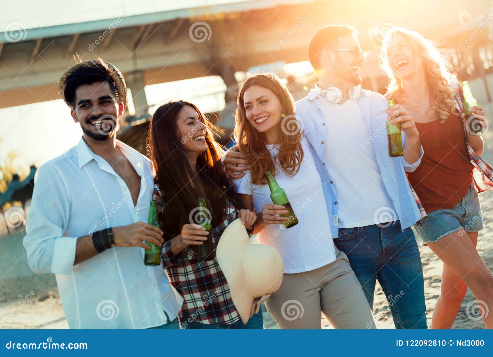 Group of Young Friends Laughing and Drinking Beer Stock Photo - Image ...