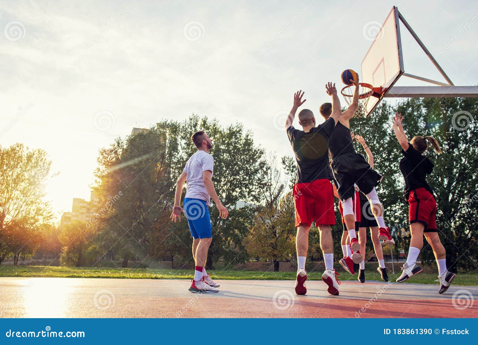 Group of Young Friends Playing Basketball Match Stock Photo Image of holding, male 183861390