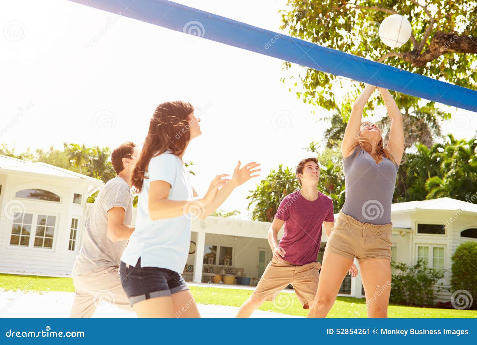 Group of Young Friends Playing Volleyball Match Stock Image Image of