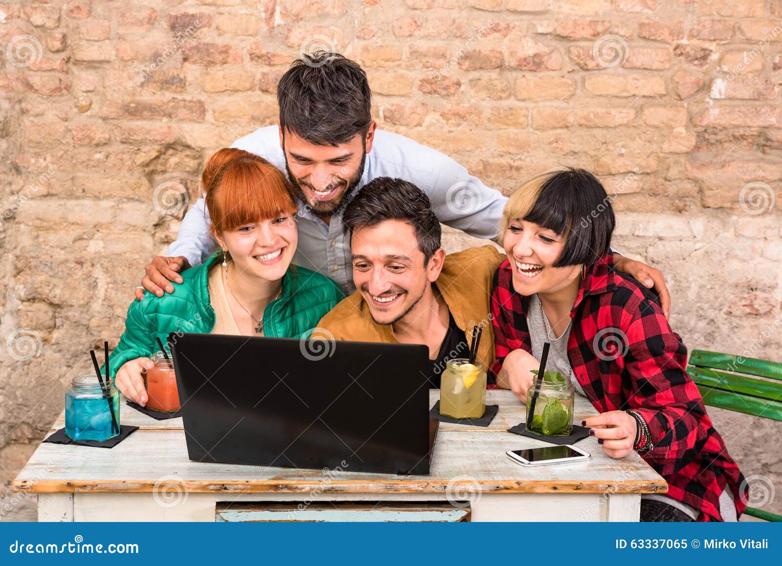 Chat online with friends using laptop Stock Photo free download