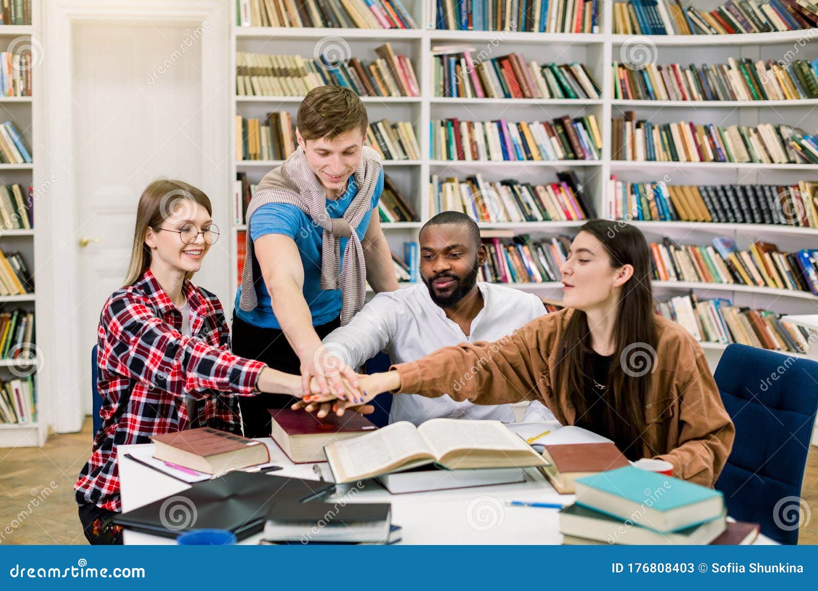 Group Of Young Joyful Multiracial College Students Collaborating On