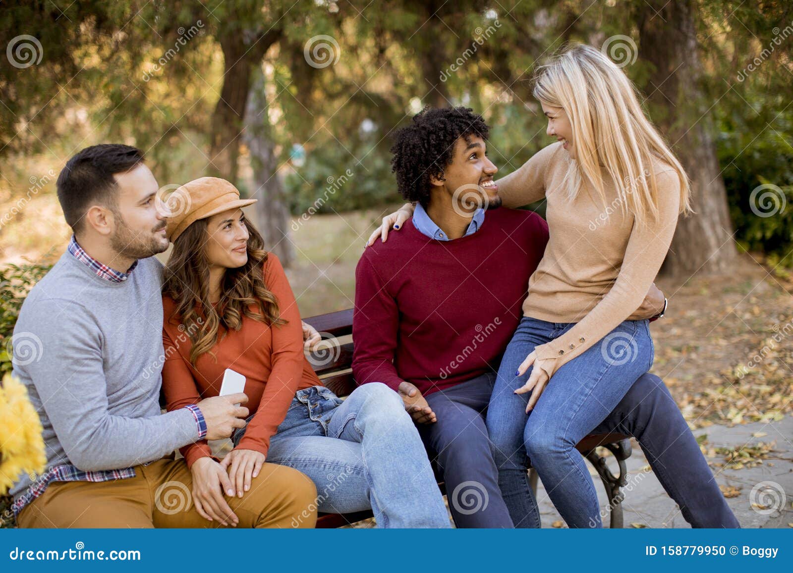 Group Of Young Multiethnic Friends Having Fun At Park Stock Photo