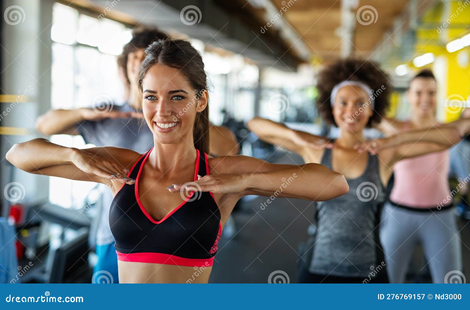 Group of Young People, Friends Smiling and Enjoy Sport in Gym