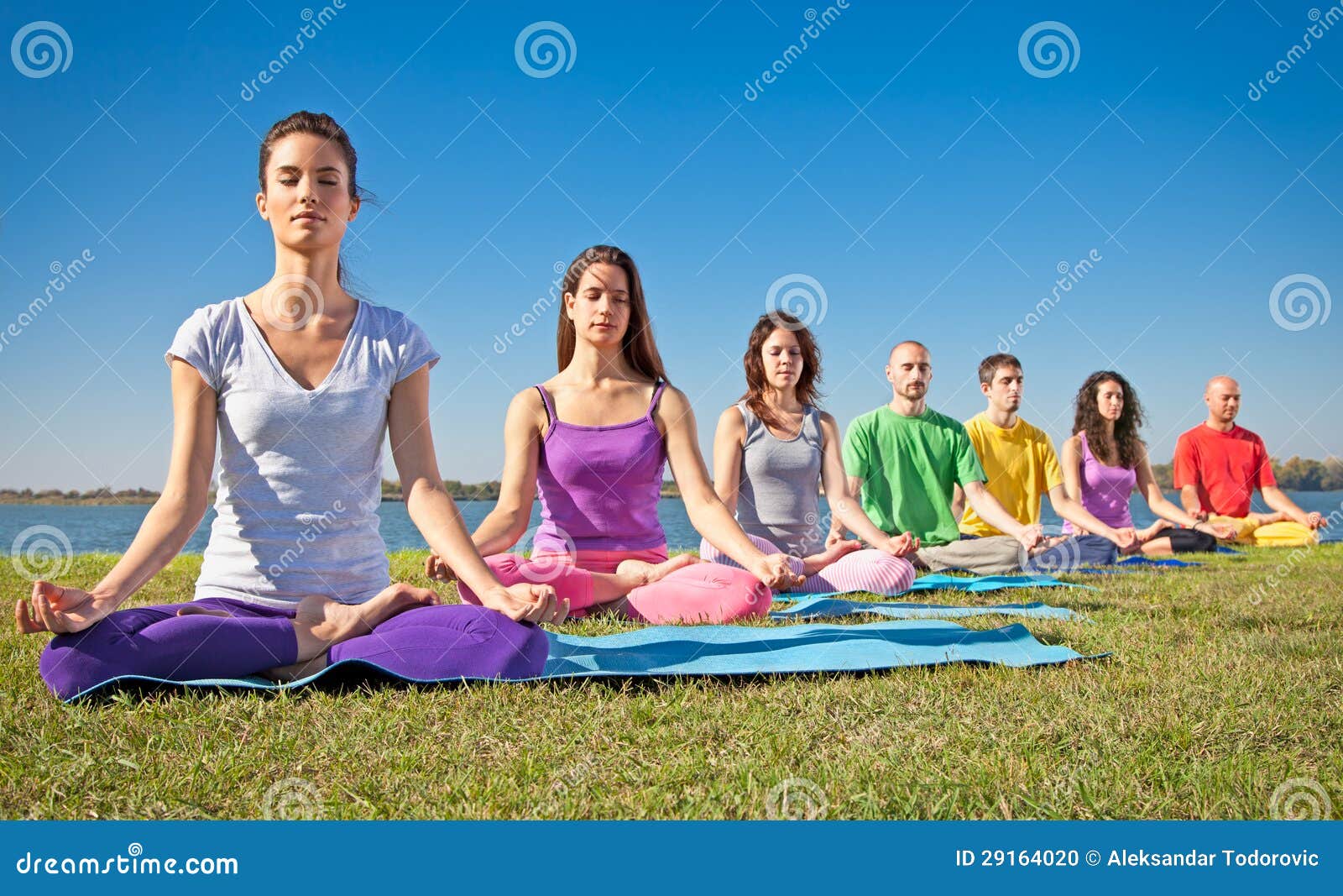 group of young people have meditation on yoga class.