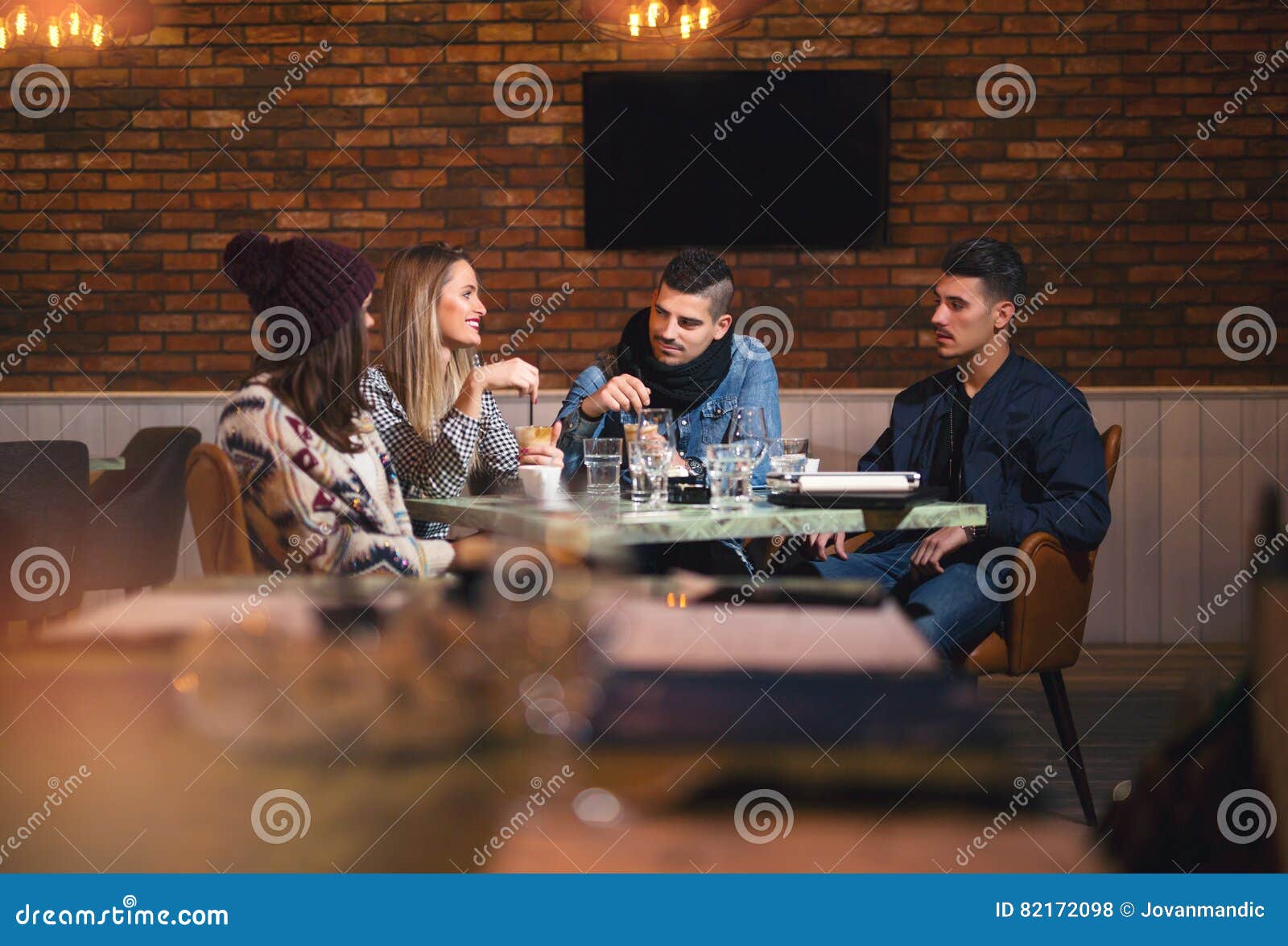 Group of Young People Sitting in a Coffee Shop Stock Photo Image of