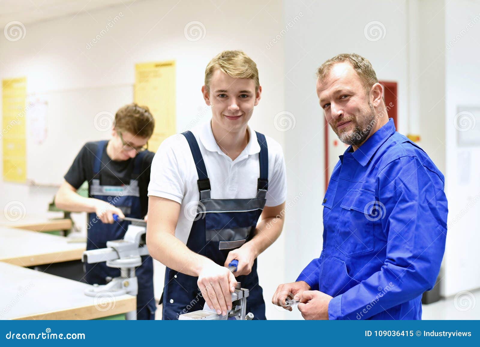 group of young people in technical vocational training with teacher