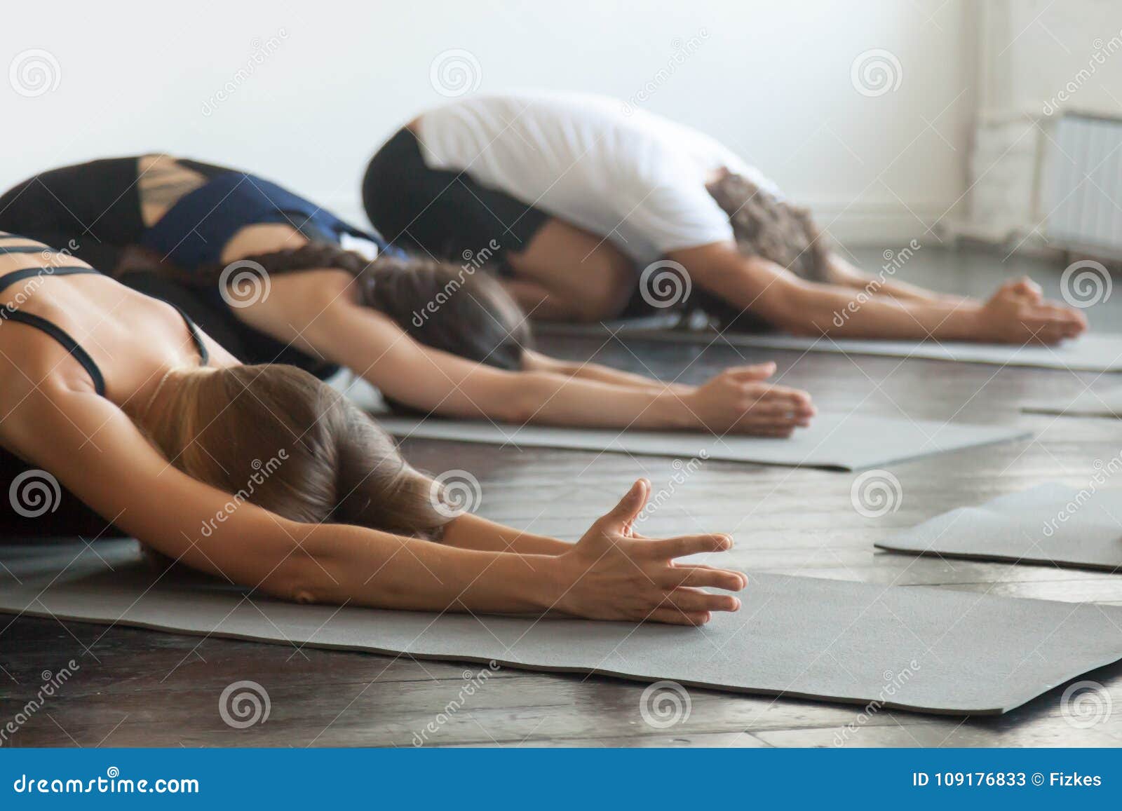 Group of Young Sporty People in Child Pose Stock Image - Image of ...