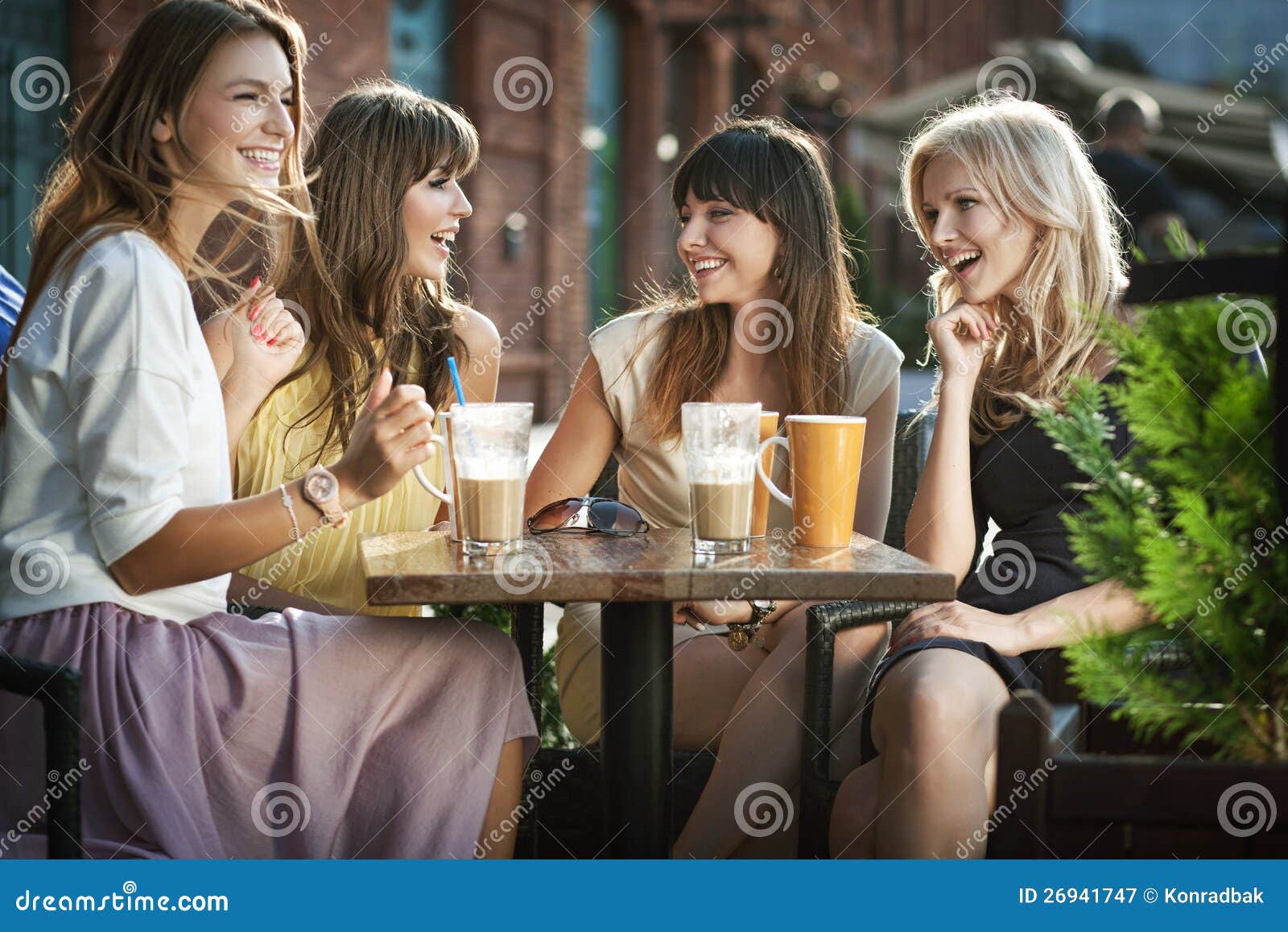 group of young women drinking coffee