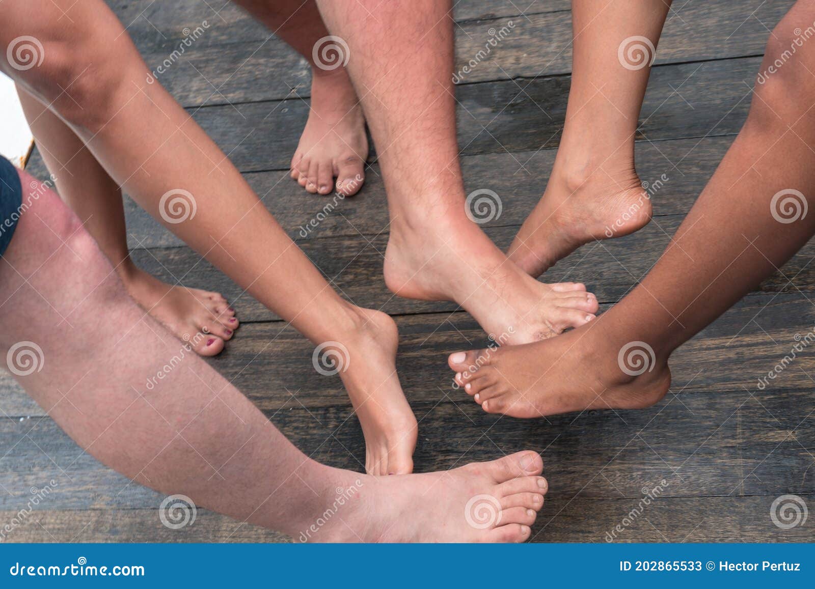 Groups Of Unrecognizable Friends Greeting Each Other With Their Feet Stock Image Image Of