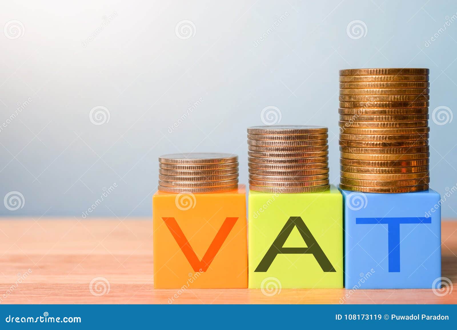 growing taxes - colour blocks with vat and money stacks