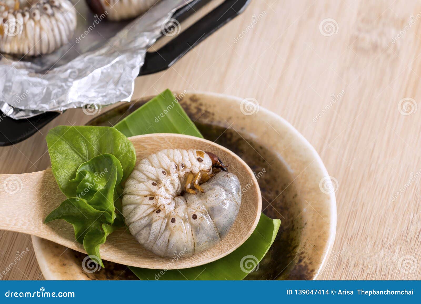 Grub Worms or Coconut Rhinoceros Beetle. Insects Food for Eating Larvae  Fried or Baked in Spoon with Vegetable on Plate and on Stock Photo - Image  of maggot, edible: 139047414