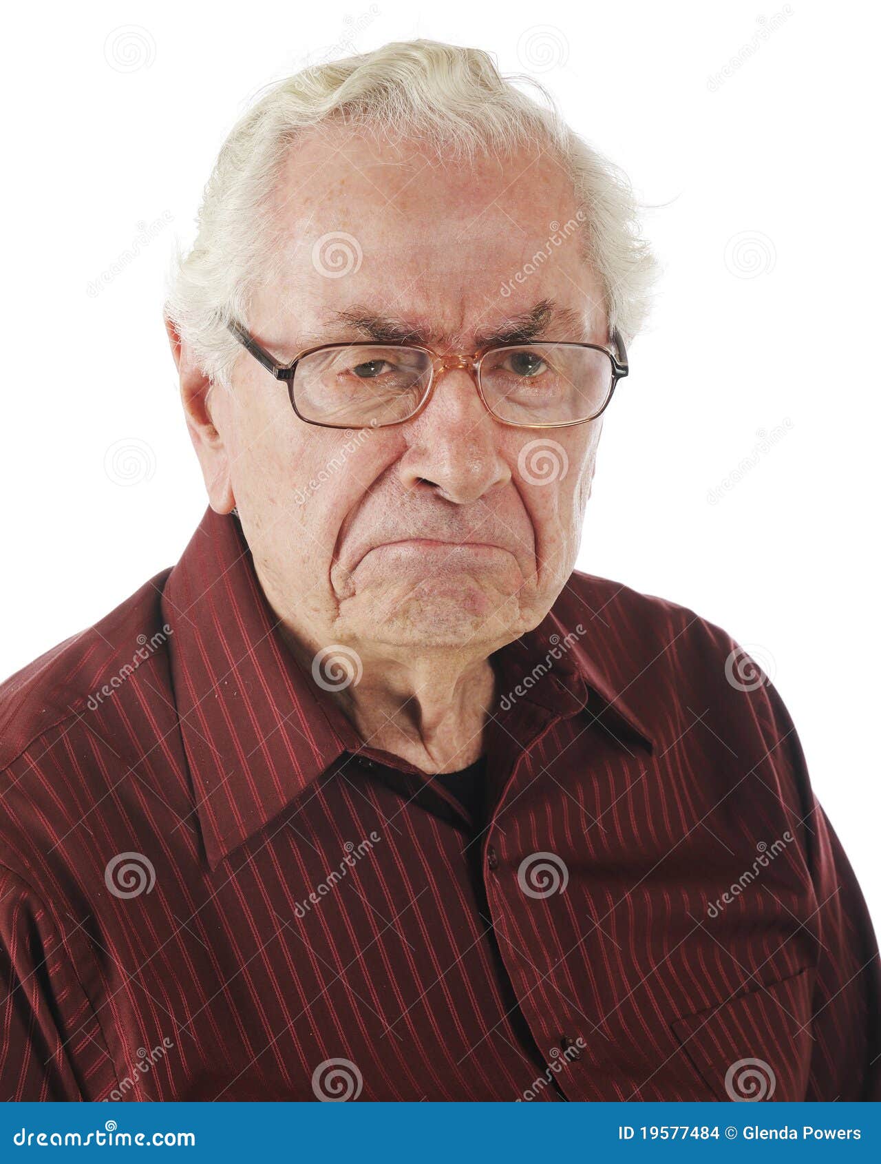 A Grumpy Old Man. Closeup portrait of a very grumpy senior man.