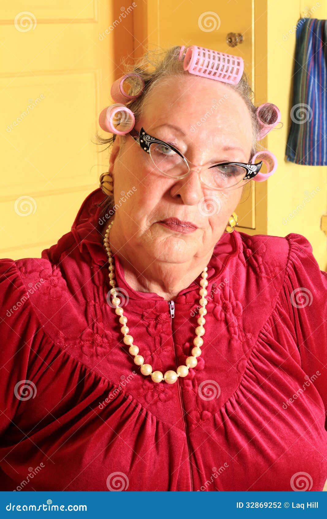 grumpy senior granny with curlers