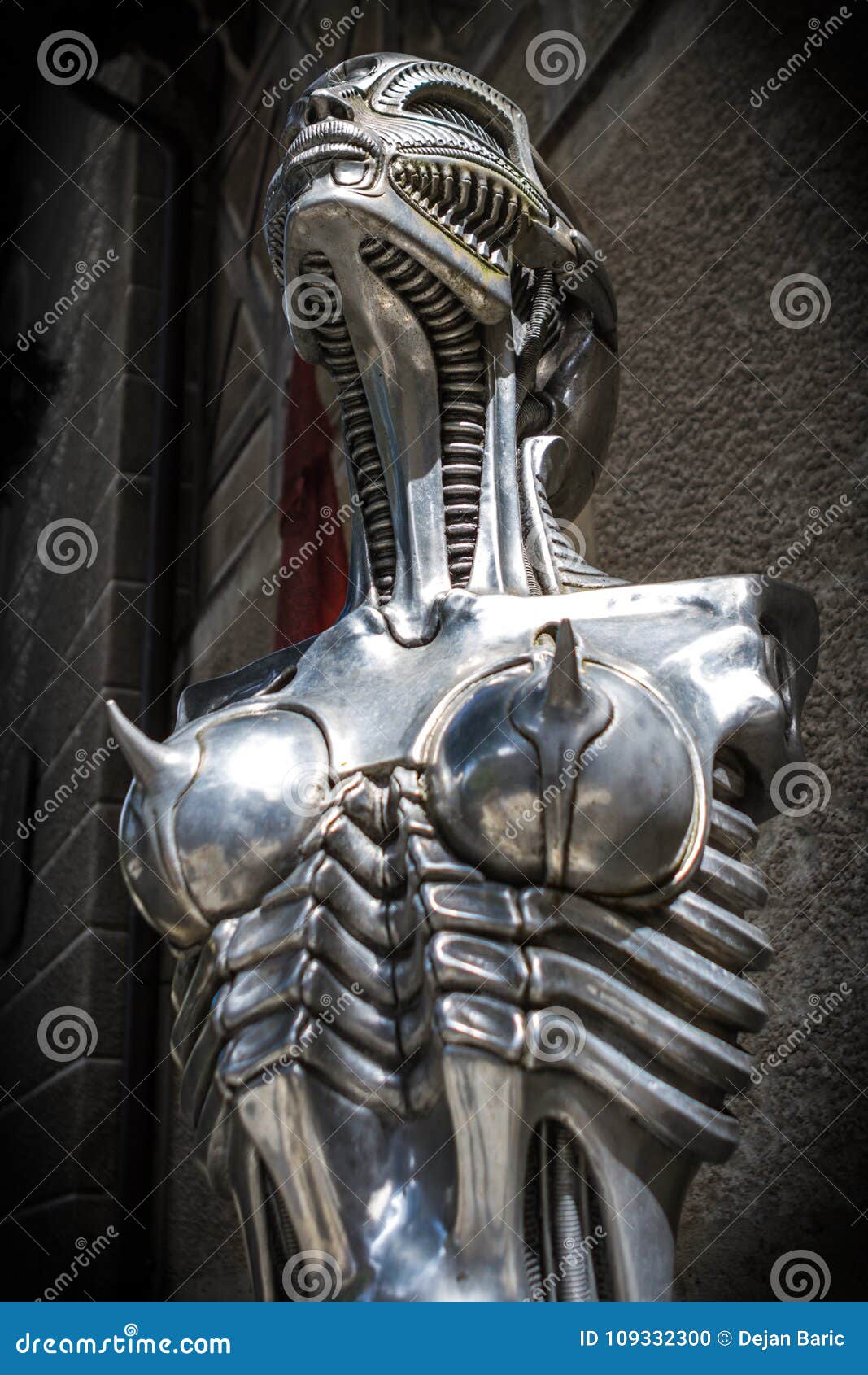 Gruyeres Switzerland June 10 16 Hr Giger Biomehanoid Statue In Front Of Giger Museum In Medieval Castle Swiss Village Editorial Image Image Of Alps Blue