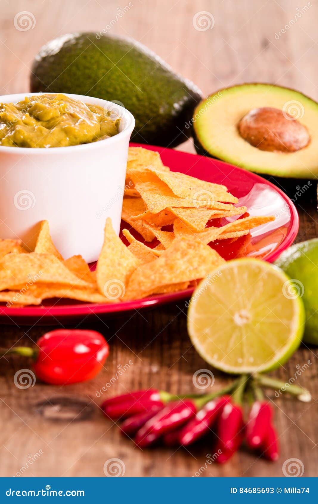 Guacamole and nacho chips. stock image. Image of cherry 84685693