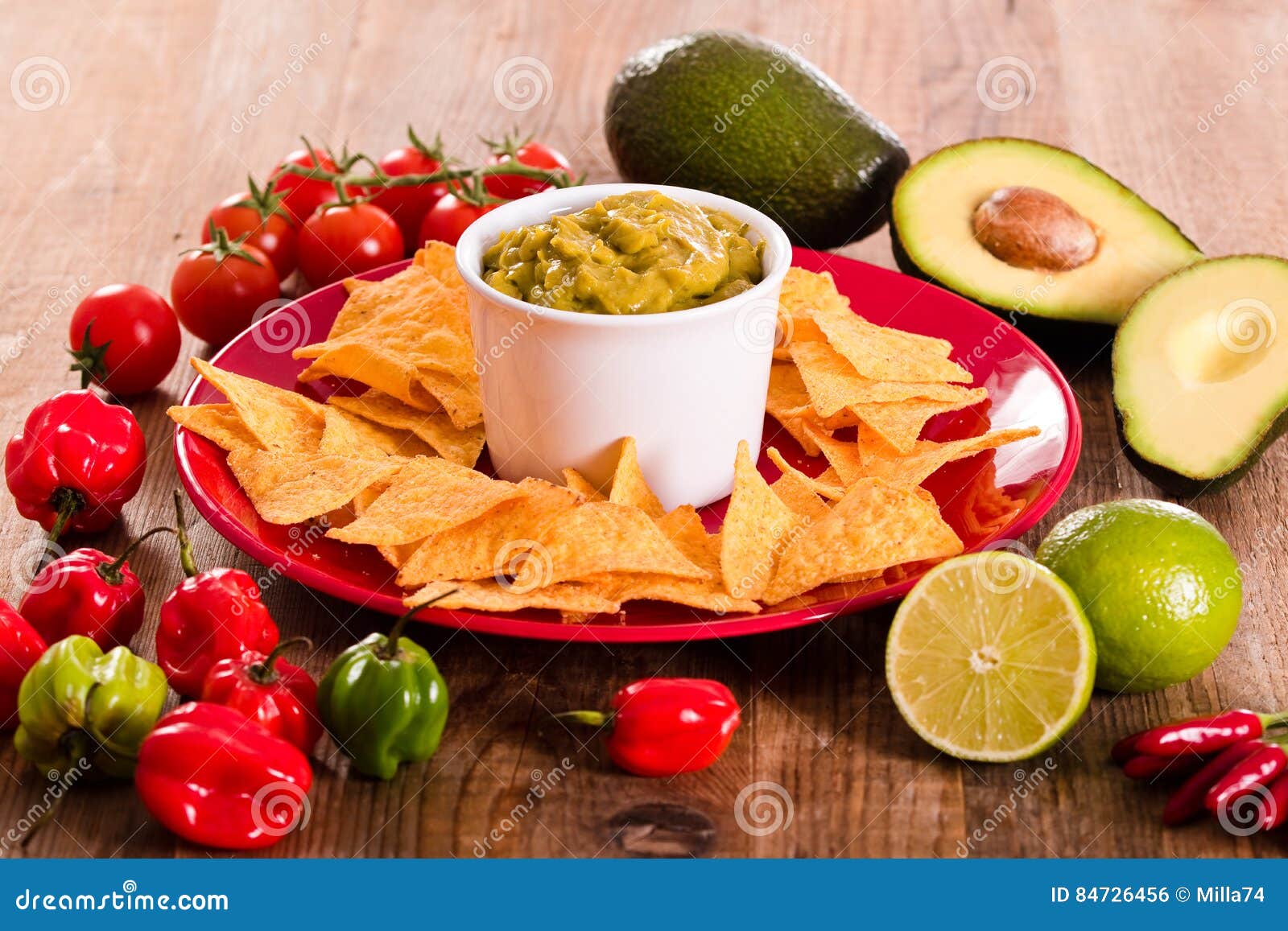 Guacamole and nacho chips. stock photo. Image of lime 84726456