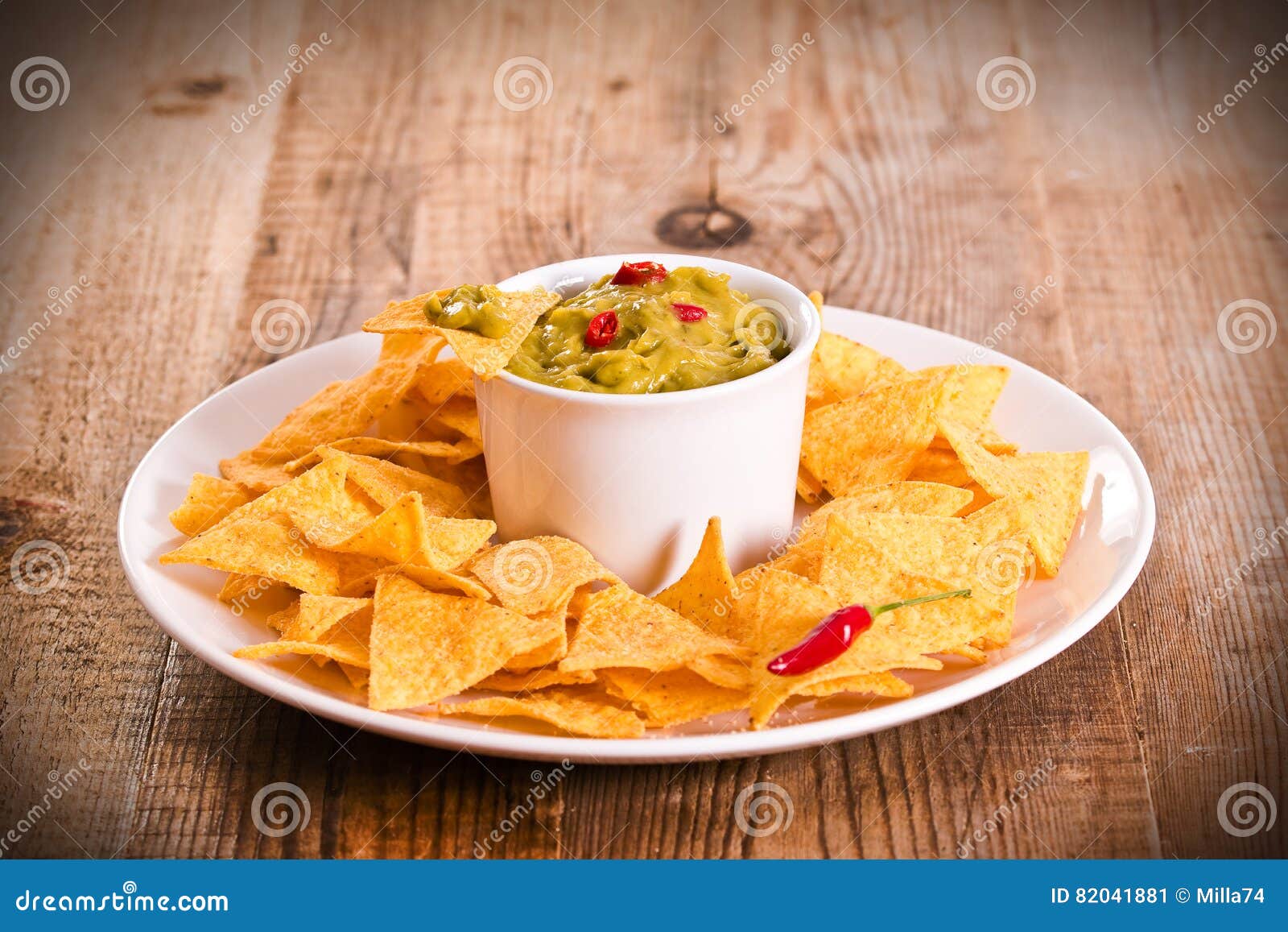 Guacamole and nacho chips. stock image. Image of corn 82041881
