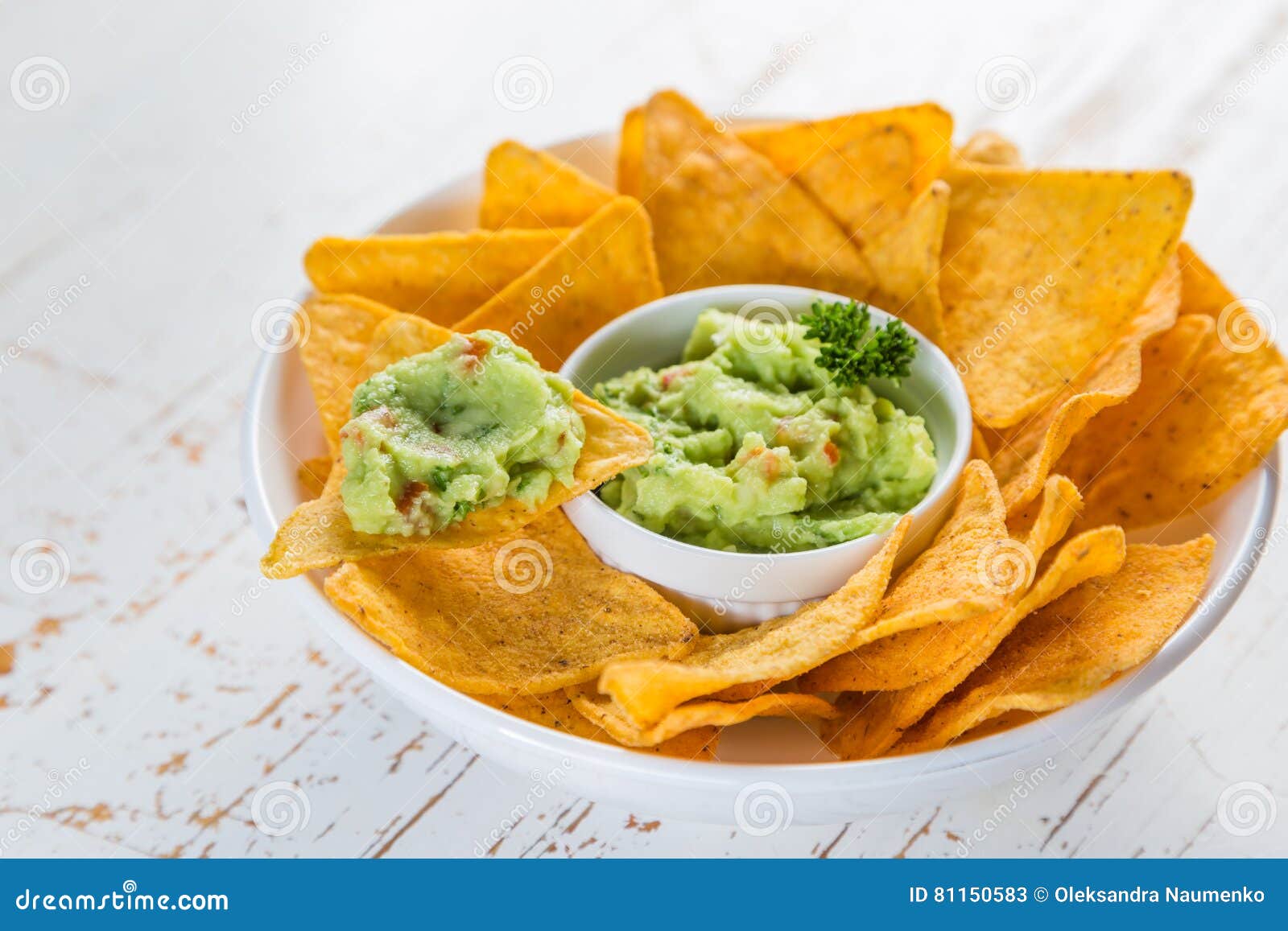 Guacamole sauce and nachos stock image. Image of sauce 81150583