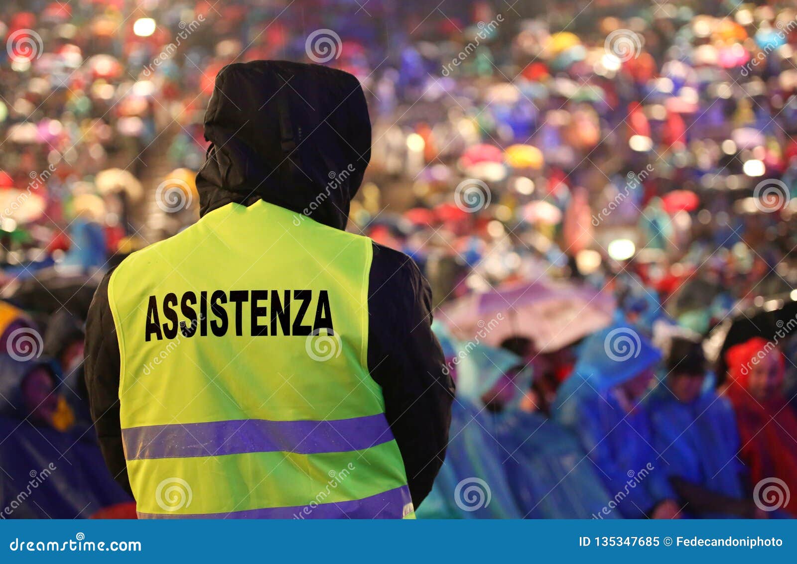 guard with the phosphorescent vest at the concert and the text a