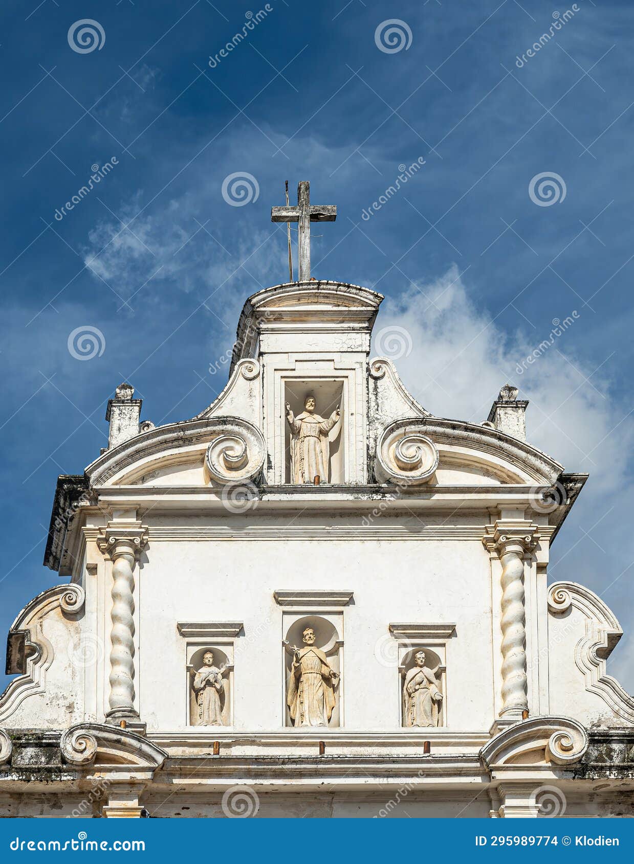 statues in facade, san francisco church portrait, la antigua, guatemala