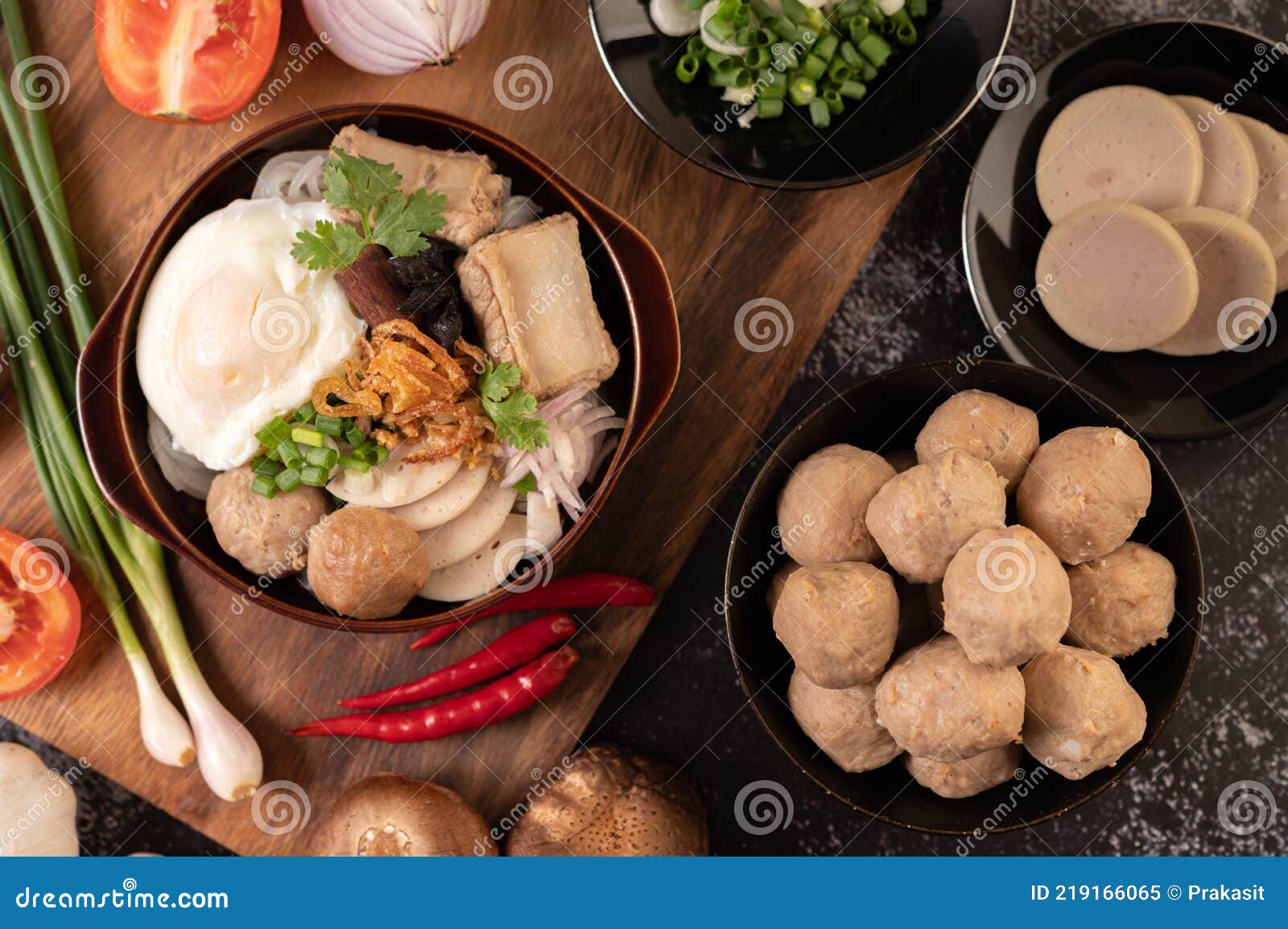 guay jap, meatballs, vietnamese pork sausage and a fried egg, thai food