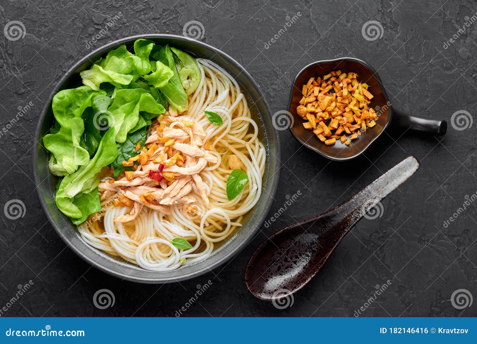 Guay Tiew Gai Cheek or Thai Chicken Noodle Soup in Black Bowl on Dark ...