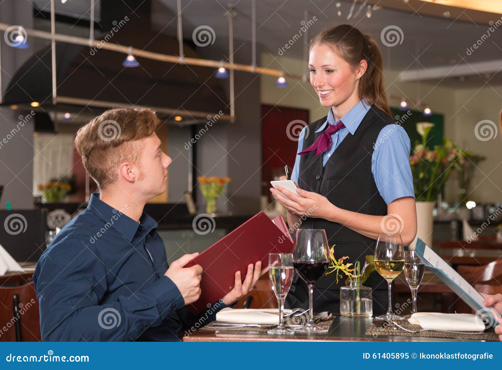 Guest in a Restaurant Orders Meal from Menu Stock Image Image of
