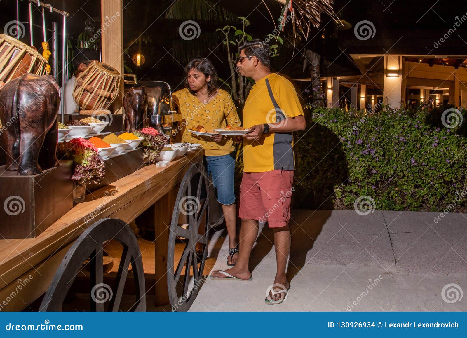 Guests Taking Food during the International Cuisine Dinner Outdoors