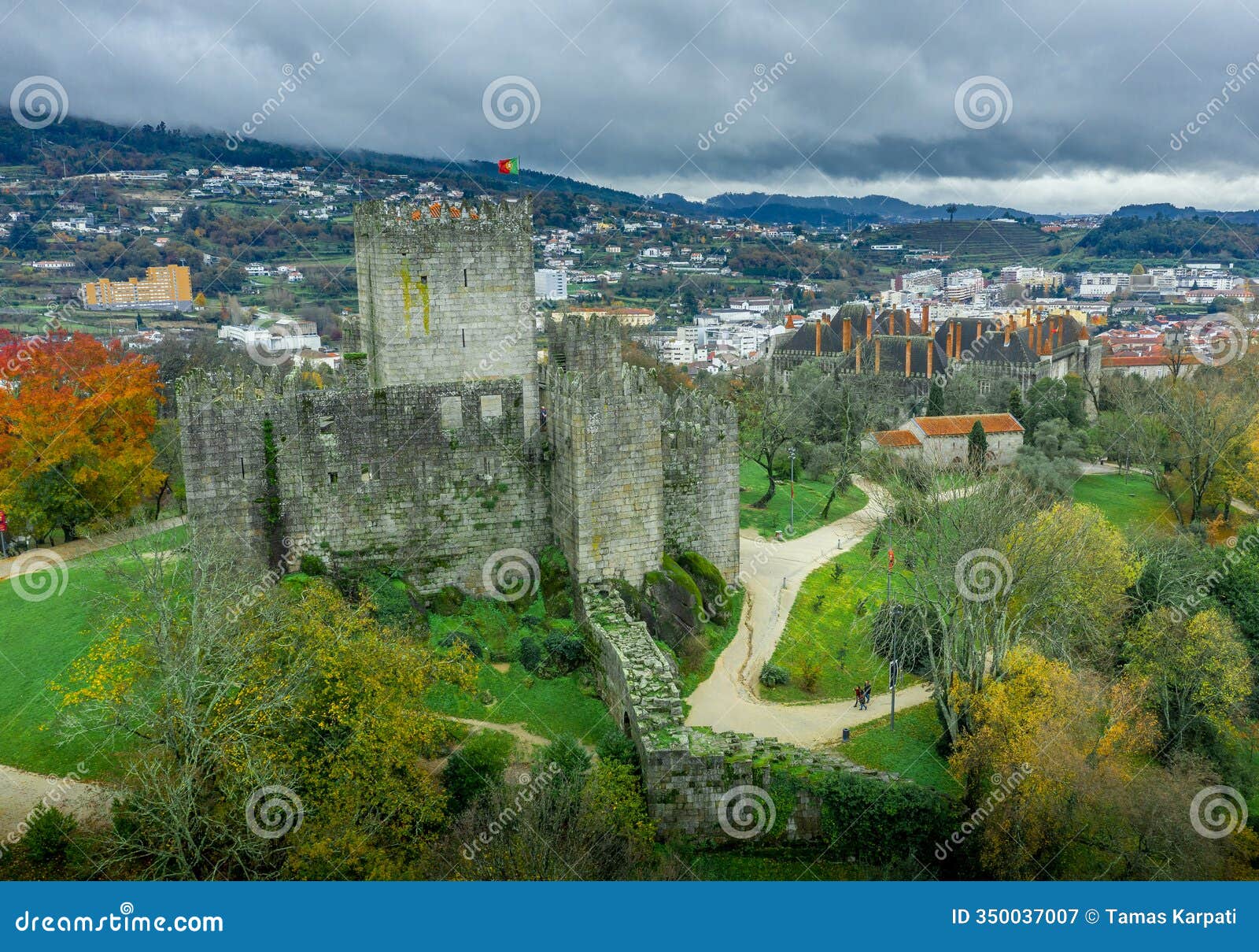 aerial view of well-preserved medieval buildings hilltop, 10th-century guimarÃ£es castle. restored dukes of braganÃ§a palace,
